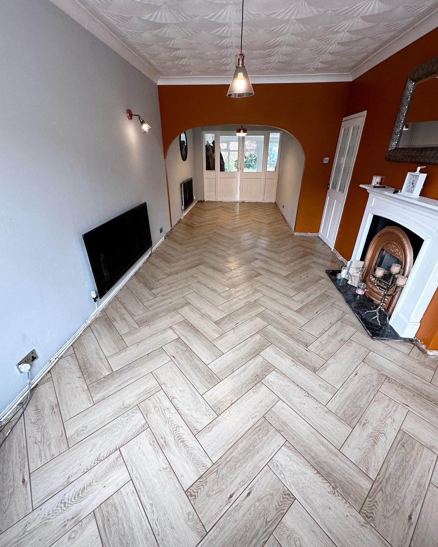 Light herringbone floor tiling in through-lounge